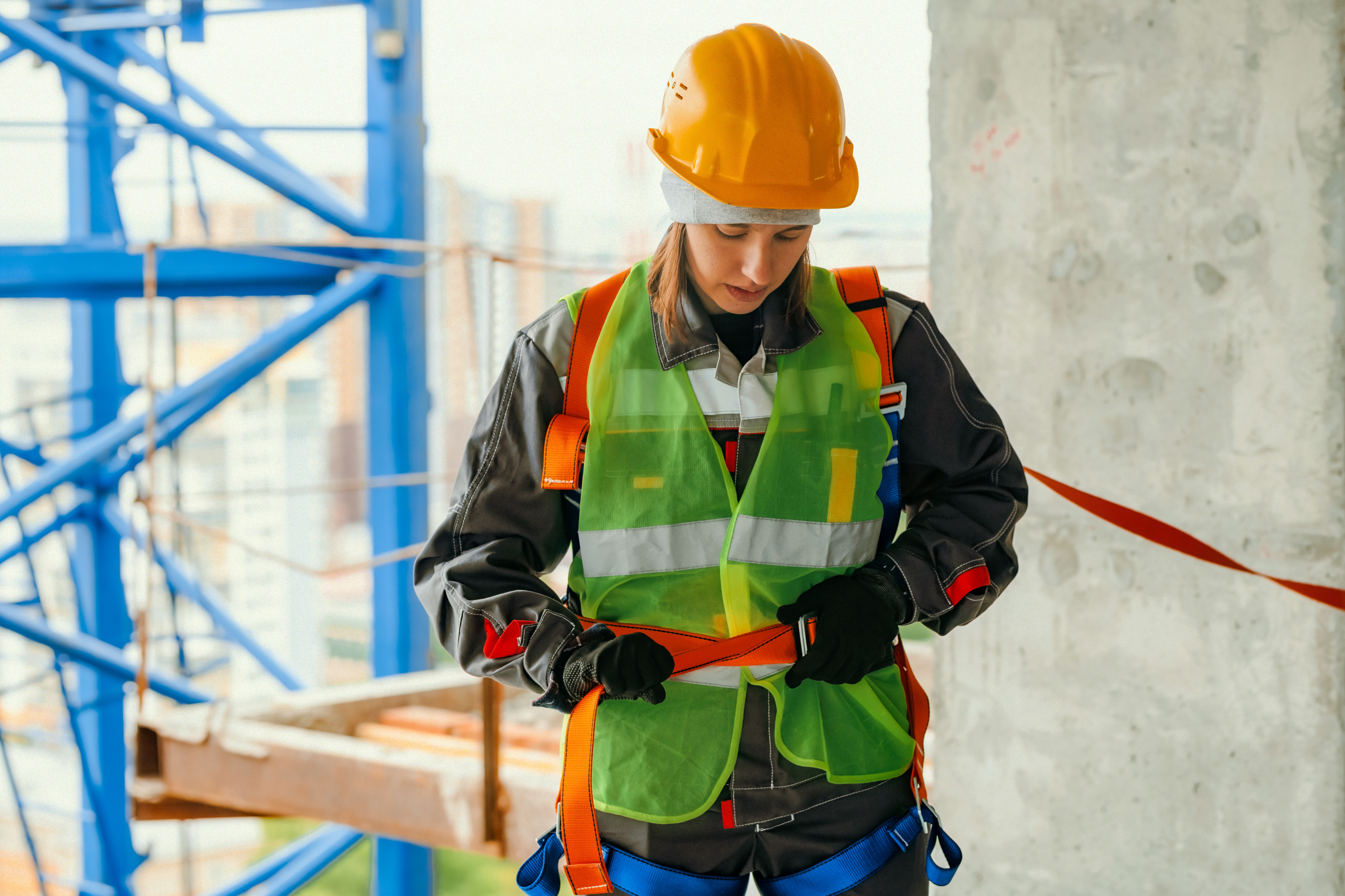 Worker preparing fall-protection equipment before work at height